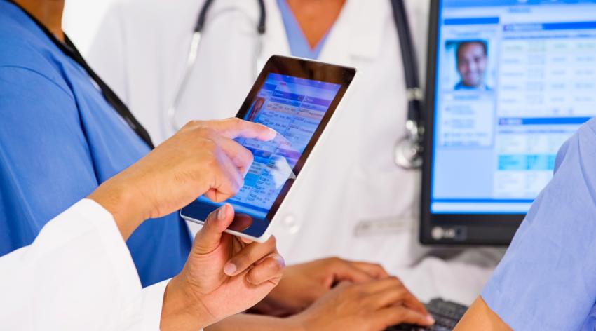 Doctors looking at a patient's electronic record