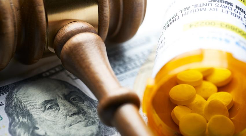Gavel with pills and money