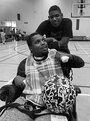 DeAndre Knox, seated, with his brother, Darrius.