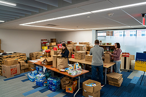 Carle Illinois College of Medicine students sort items donated for Ukrainian refugees that were collected from five drop-off sites in Champaign.