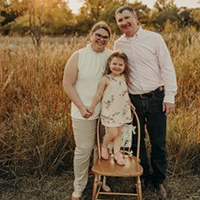 Jennifer Keating, MD, JD, psychiatry resident at the University of South Dakota Sanford School of Medicine in Sioux Falls, poses with her family.