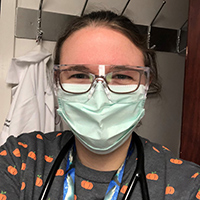 Laura Selby, DO, infectious diseases fellow at the University of Nebraska Medical Center in Omaha, poses for a selfie in personal protective equipment.