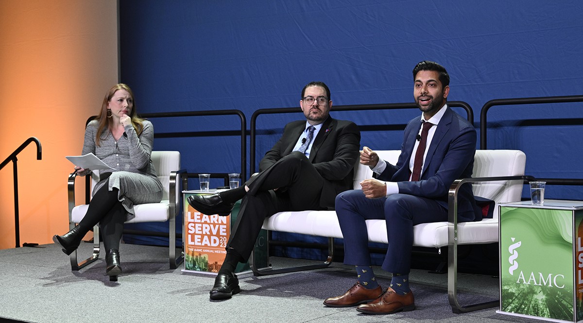 Trauma surgeons Joseph Sakran, MD, center, and Chethan Sathya, MD, right, discuss a public health approach to firearm deaths with violence-prevention expert and moderator Ashley Hink, MD, MPH.