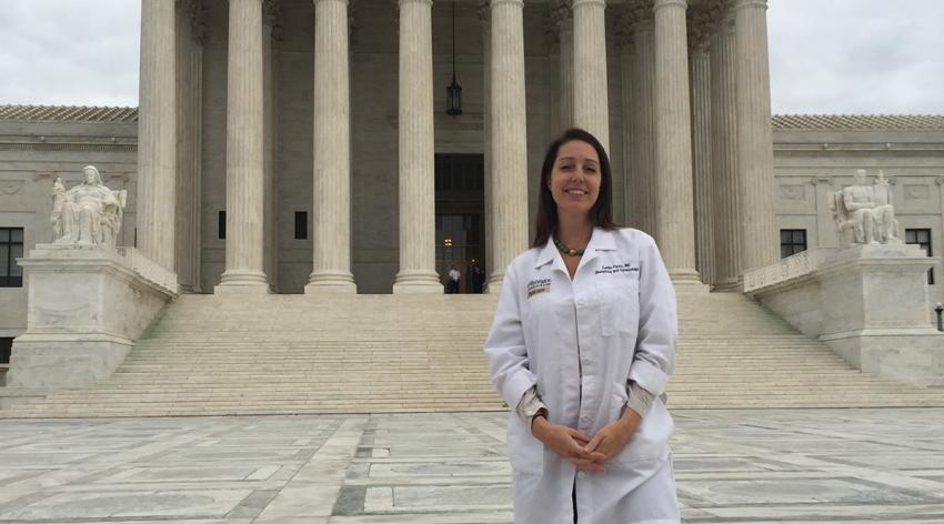 Caitlin Bernard, MD, in front of the U.S. Supreme Court during a 2017 leadership training institute hosted by Physicians for Reproductive Health.