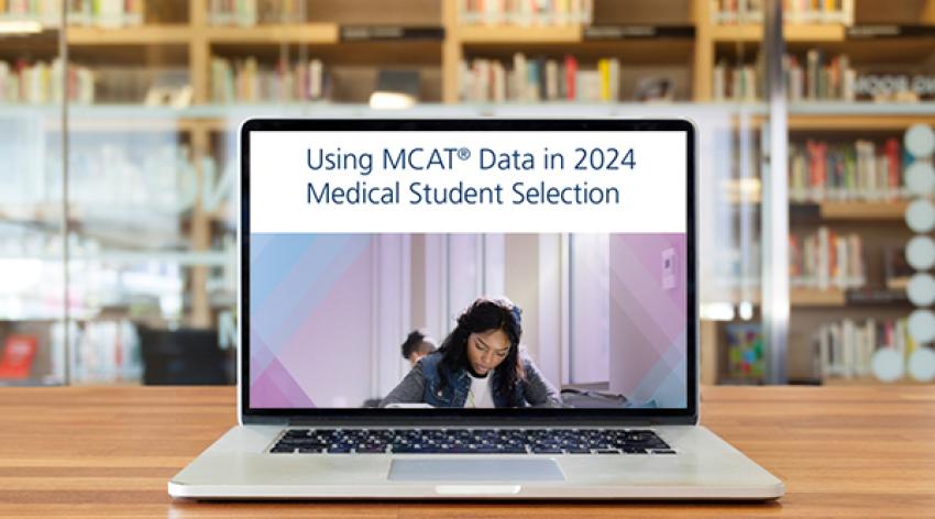 Laptop showing the cover of the Using MCAT Data in 2024 Medical Student Selection guide